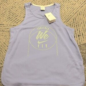 Size medium woman’s light purple jersey Nike